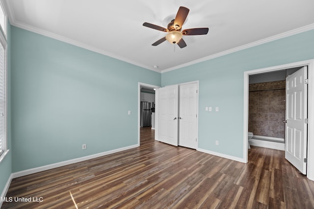 1515 E Beach Blvd Unit 114, Pass Christian, MS 39571 - unfurnished bedroom with crown molding, baseboards, dark wood-style flooring, ensuite bath, and a ceiling fan