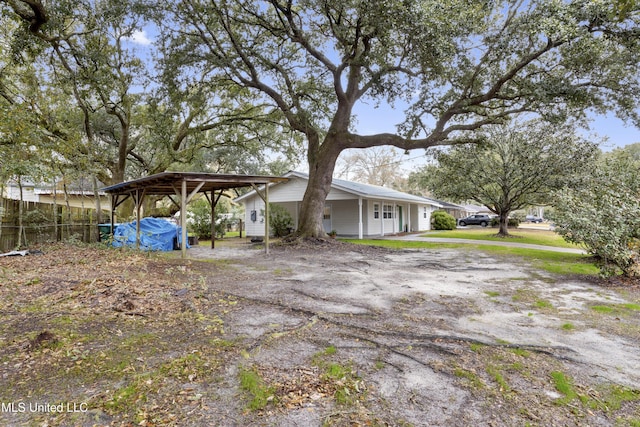 view of property exterior with a carport