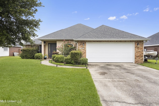 311 Pinecrest Blvd, Long Beach, MS 39560 - view of front of home with a front yard, a garage, driveway, a shingled roof, and brick siding