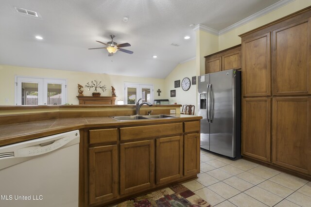 311 Pinecrest Blvd, Long Beach, MS 39560 - kitchen with stainless steel fridge, white dishwasher, a sink, french doors, and ceiling fan