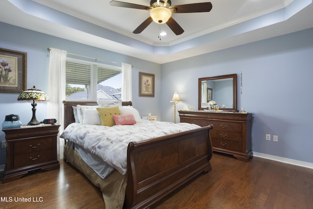 311 Pinecrest Blvd, Long Beach, MS 39560 - bedroom featuring dark wood finished floors, a tray ceiling, ornamental molding, baseboards, and a ceiling fan