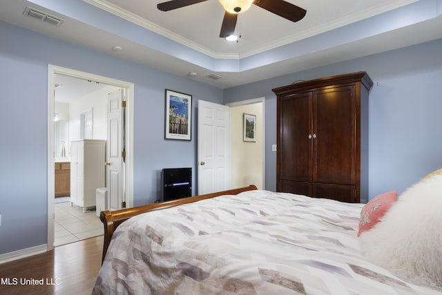 311 Pinecrest Blvd, Long Beach, MS 39560 - bedroom with wood finished floors, ornamental molding, baseboards, ceiling fan, and ensuite bathroom
