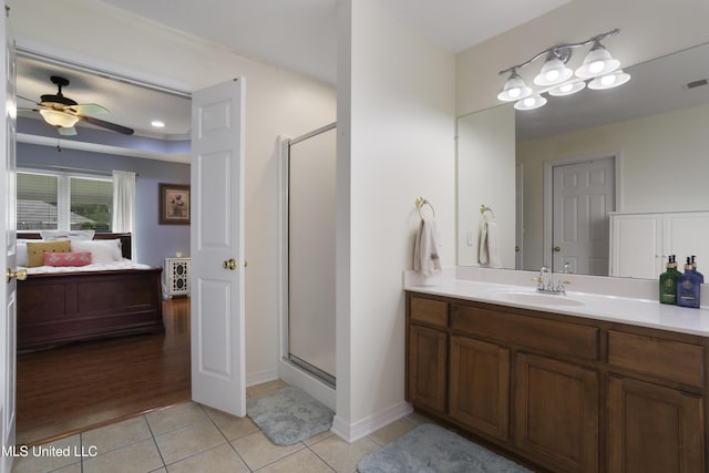 311 Pinecrest Blvd, Long Beach, MS 39560 - full bathroom with connected bathroom, tile patterned floors, a ceiling fan, a stall shower, and vanity