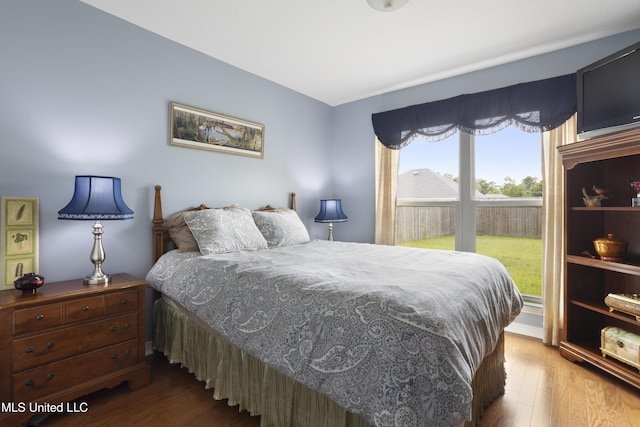 311 Pinecrest Blvd, Long Beach, MS 39560 - bedroom featuring access to exterior, multiple windows, and wood finished floors