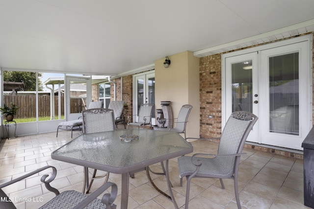 311 Pinecrest Blvd, Long Beach, MS 39560 - view of patio / terrace featuring french doors, fence, and outdoor dining area
