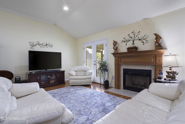 311 Pinecrest Blvd, Long Beach, MS 39560 - living area with lofted ceiling, wood finished floors, a tile fireplace, recessed lighting, and baseboards