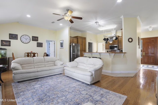 311 Pinecrest Blvd, Long Beach, MS 39560 - living room featuring ceiling fan, light wood-style floors, baseboards, crown molding, and recessed lighting