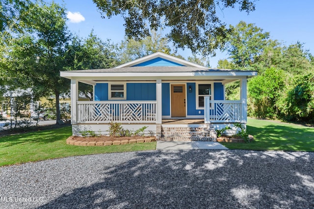 bungalow-style house featuring a porch and a front lawn