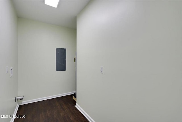 interior space with electric panel and dark hardwood / wood-style flooring