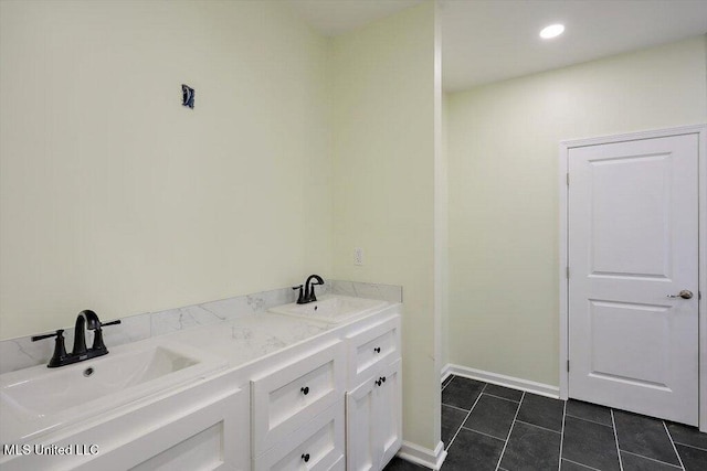 bathroom with vanity and tile patterned floors