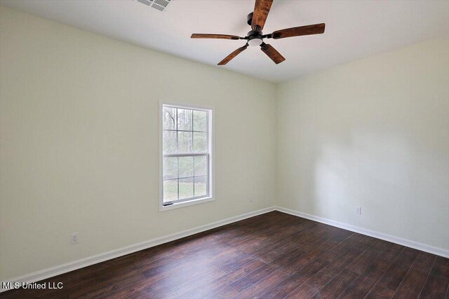 104 Patricia Cv, Raymond, MS 39154 - spare room with ceiling fan, dark wood-style floors, and baseboards