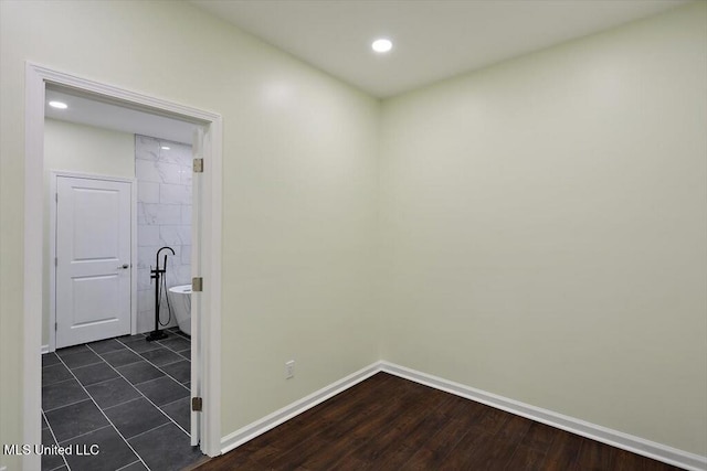 corridor featuring dark wood-type flooring