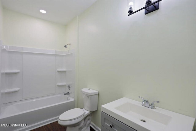 full bathroom with toilet, vanity, hardwood / wood-style flooring, and shower / bathing tub combination