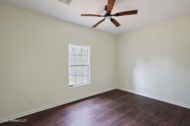 unfurnished room featuring dark wood-type flooring and ceiling fan