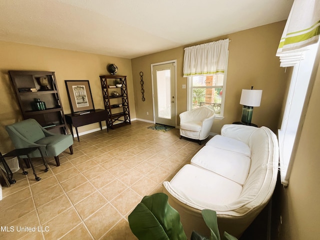 2501 Gulf Ave Unit 22, Gulfport, MS 39501 - living area featuring light tile patterned flooring and baseboards