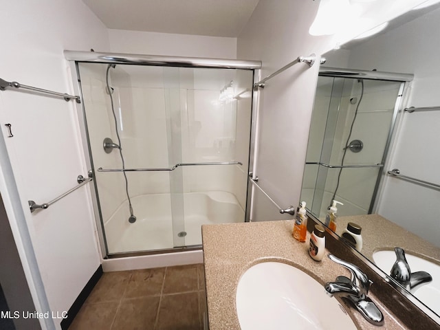 2501 Gulf Ave Unit 22, Gulfport, MS 39501 - full bathroom with a shower stall, vanity, and tile patterned flooring