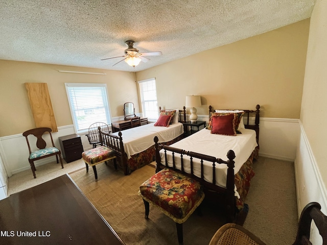 2501 Gulf Ave Unit 22, Gulfport, MS 39501 - carpeted bedroom featuring a textured ceiling and ceiling fan