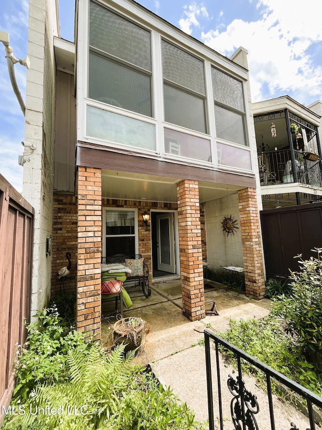 2501 Gulf Ave Unit 22, Gulfport, MS 39501 - rear view of property featuring brick siding