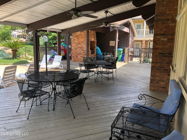 2501 Gulf Ave Unit 22, Gulfport, MS 39501 - deck featuring outdoor dining space and ceiling fan