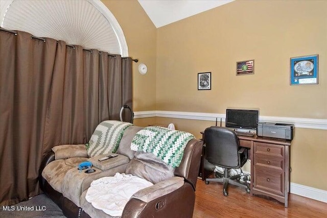 19101 Rucks Krans Rd, Moss Point, MS 39562 - bedroom with vaulted ceiling, wood finished floors, a desk, and baseboards
