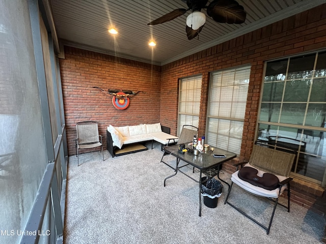 19101 Rucks Krans Rd, Moss Point, MS 39562 - carpeted living area featuring brick wall, ceiling fan, and ornamental molding