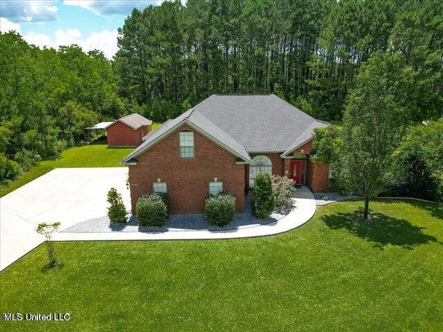 19101 Rucks Krans Rd, Moss Point, MS 39562 - view of front of house with a front yard and brick siding