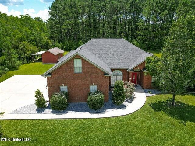 19101 Rucks Krans Rd, Moss Point, MS 39562 - view of front of house with a front yard and brick siding