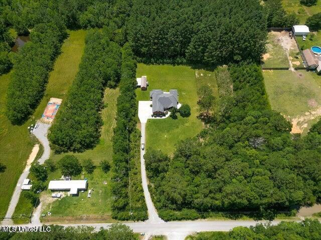 19101 Rucks Krans Rd, Moss Point, MS 39562 - aerial view of property and surrounding area featuring a forest