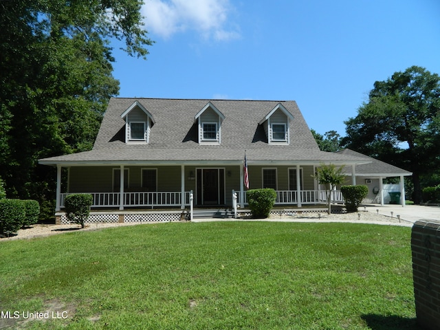 view of front of home featuring covered porch and a front yard