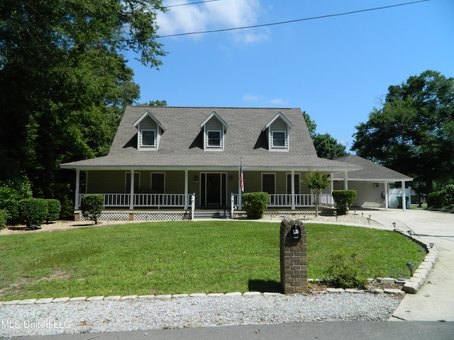 view of front of house with a front yard and covered porch