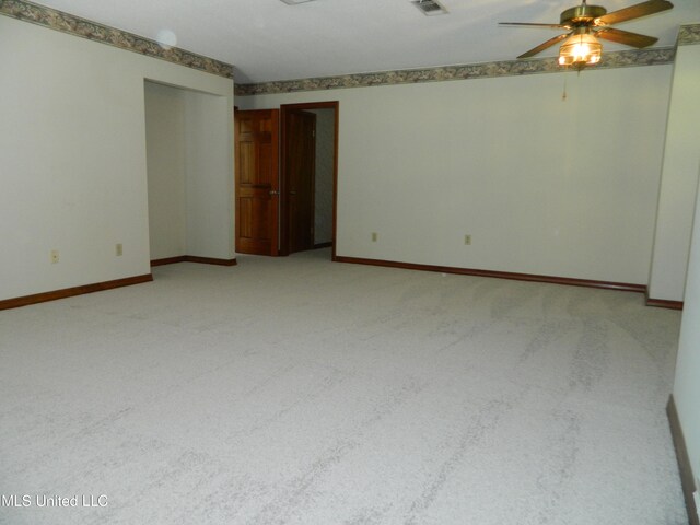 carpeted empty room with ceiling fan