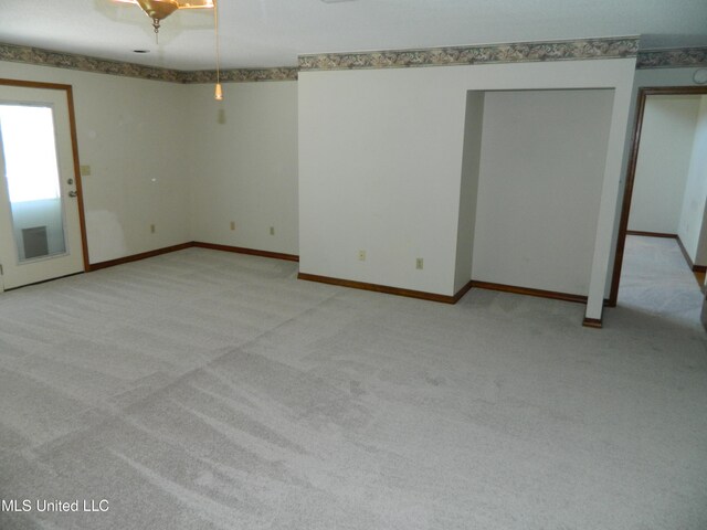 empty room with light colored carpet