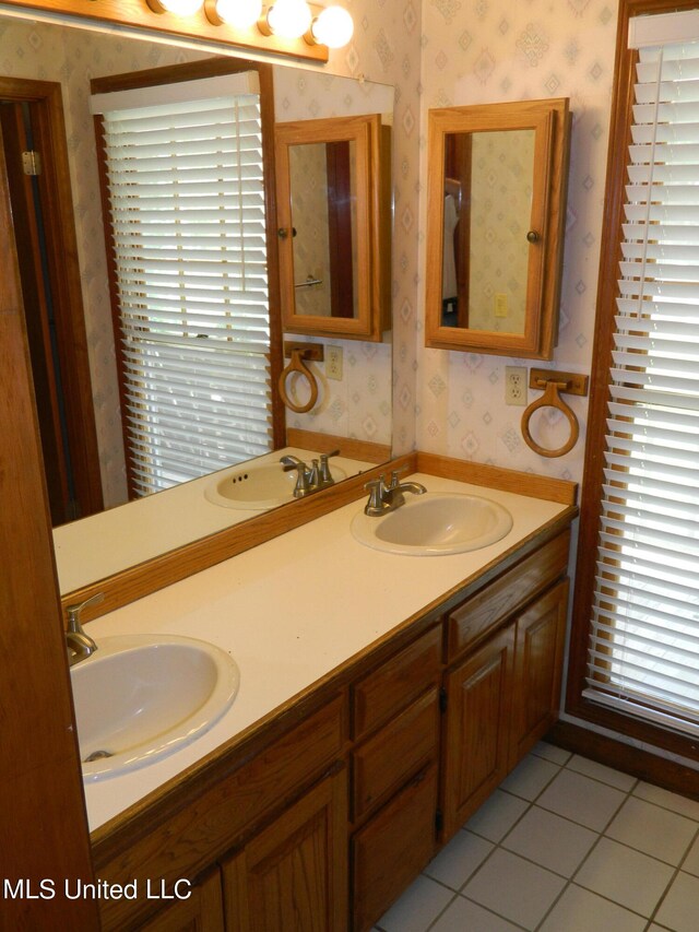 bathroom featuring vanity, plenty of natural light, and tile patterned flooring