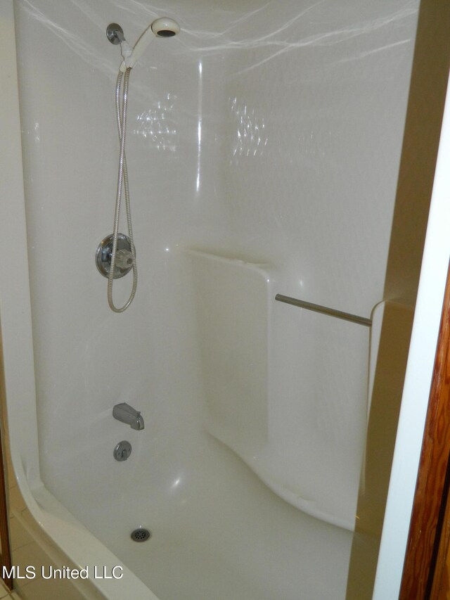 bathroom with shower / bathing tub combination