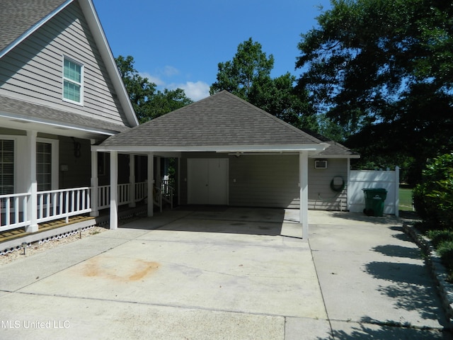 exterior space with a carport