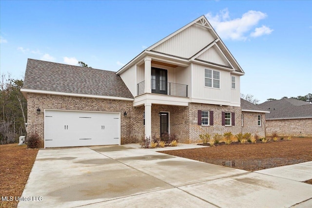 view of front of home featuring a garage and a balcony