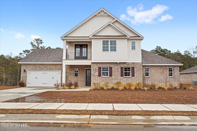 craftsman-style house featuring a balcony and a garage