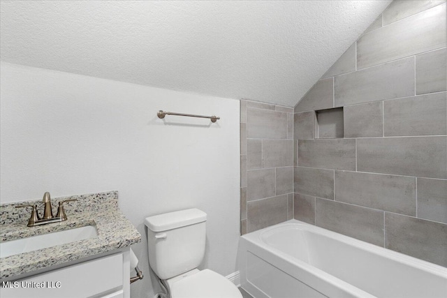 full bathroom with toilet, tiled shower / bath, vaulted ceiling, vanity, and a textured ceiling