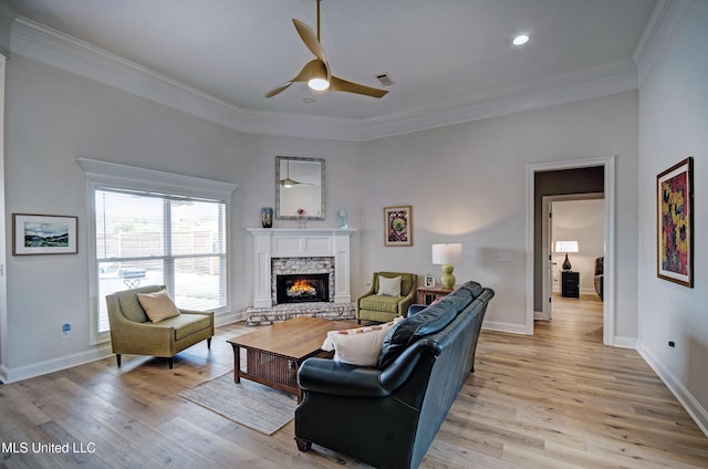 312 Faith Way, Brandon, MS 39042 - living room with ceiling fan, a fireplace, light wood-style flooring, crown molding, and baseboards
