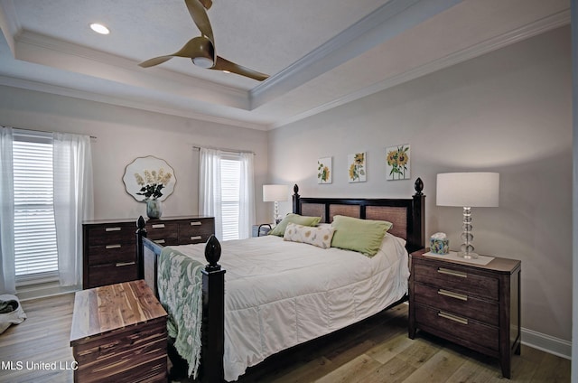 312 Faith Way, Brandon, MS 39042 - bedroom with a tray ceiling, light wood-style floors, ornamental molding, a ceiling fan, and baseboards