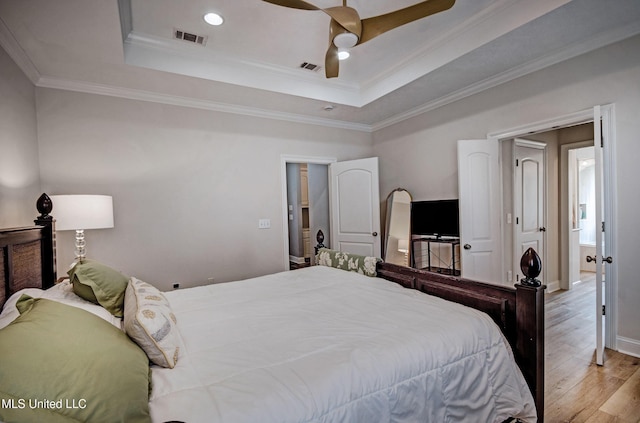 312 Faith Way, Brandon, MS 39042 - bedroom with wood finished floors, a raised ceiling, baseboards, crown molding, and ceiling fan