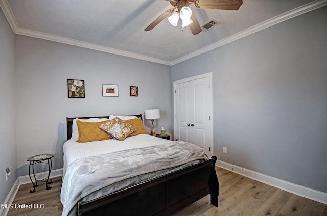 312 Faith Way, Brandon, MS 39042 - bedroom featuring light wood finished floors, baseboards, ornamental molding, a closet, and ceiling fan