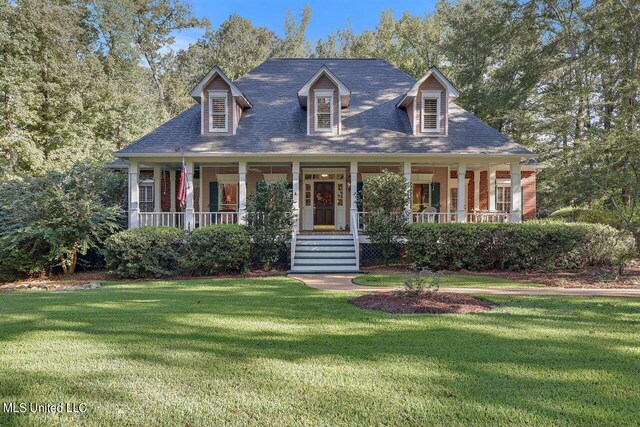 cape cod home with a porch and a front yard