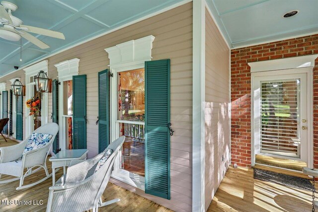 exterior space featuring a ceiling fan and covered porch