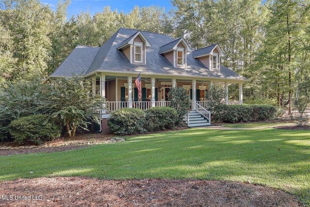 cape cod home featuring a front yard and covered porch