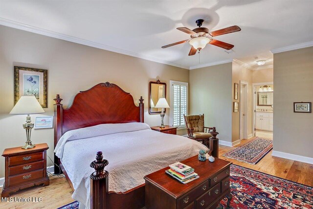 bedroom featuring connected bathroom, ceiling fan, light wood-style floors, baseboards, and ornamental molding