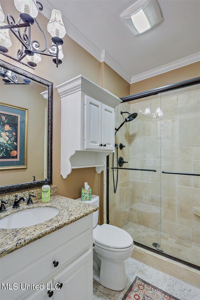 full bathroom featuring crown molding, vanity, toilet, visible vents, and a stall shower