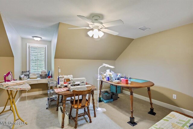 interior space featuring ceiling fan, light colored carpet, baseboards, lofted ceiling, and visible vents