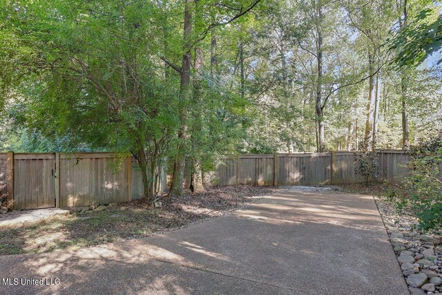 view of patio featuring fence