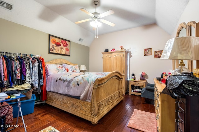 bedroom featuring ceiling fan, dark hardwood / wood-style floors, and lofted ceiling